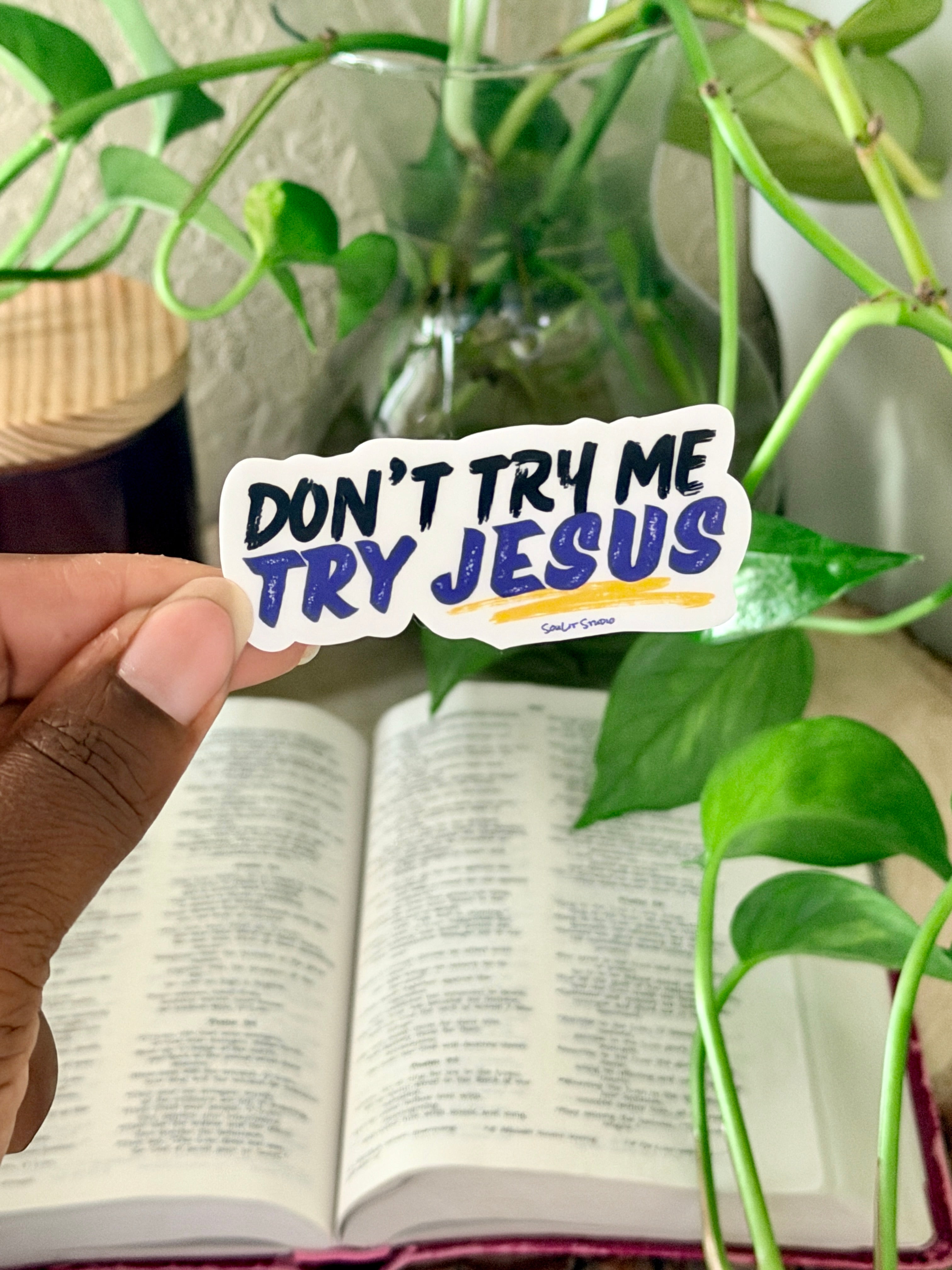 Vinyl sticker that reads "Don't Try Me, Try Jesus" in black and purple typography.